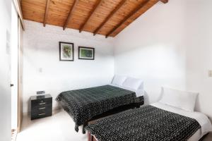 Postel nebo postele na pokoji v ubytování Fami Hotel Vive Jardin