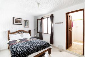 Postel nebo postele na pokoji v ubytování Fami Hotel Vive Jardin