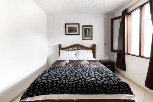 Postel nebo postele na pokoji v ubytování Fami Hotel Vive Jardin