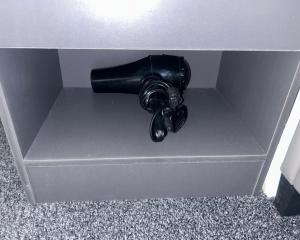 a black pipe sticking out of a gray box at Students Contractors Professionals in Leicester