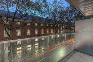 a glass balcony with a view of a street at Grays Inn by Q Apartments in London