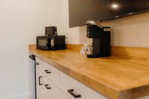 a kitchen with a counter top with a coffee maker at Bingham Motor Inn in Bingham