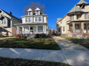 a large house with a driveway in front of it at Stay with Jay Cleveland One in Cleveland