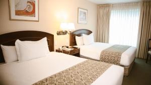 Cama ou camas em um quarto em Los Tallanes Hotel & Suites