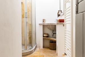 a bathroom with a shower and a sink at Sopra i Sassi - Villa & Trulli in Ostuni