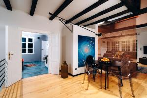 a dining room with a table and chairs at Joy Village in Warsaw