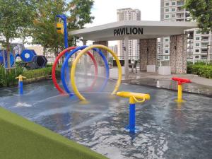 a water park in a city with a water slide at Seaview Infinity Pool #6pax #2bedroom #2bathroom in Jelutong