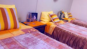 Ein Bett oder Betten in einem Zimmer der Unterkunft HOTEL VISTA HERMOSA