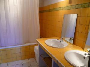 a bathroom with a sink and a mirror and a tub at Laborde in Mimbaste +4 photos