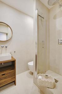 a bathroom with a shower and a toilet and a sink at Luxury Duplex by Les Maisons de Charloc Homes in Boulogne-Billancourt
