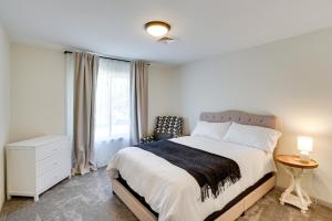 a bedroom with a bed and a chair and a window at Terrebonne Home Steps to Deschutes River! in Terrebonne