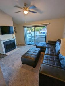 a living room with a couch and a fireplace at 2 Bed 2 Bath with pool and spa in Phoenix