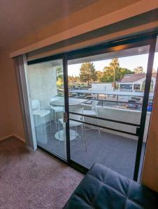 a room with a balcony with a table and chairs at 2 Bed 2 Bath with pool and spa in Phoenix