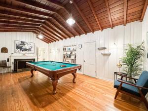 a pool table in a living room with a ceiling at Stylish 4BR House Near UCLA - WIL - Bre in Los Angeles