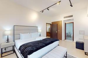 Postel nebo postele na pokoji v ubytování East Heights Tower B - Modern One Bedroom in Business Bay