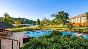 an image of a resort with a swimming pool at African Sky Hotels - Pine Lake Inn in White River