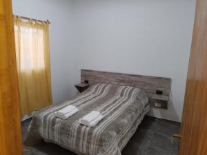 Una cama o camas en una habitación de Alojamiento Mesas