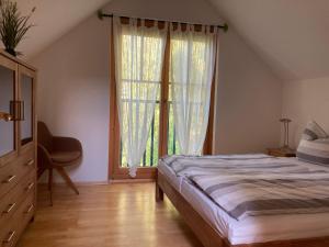 Ένα ή περισσότερα κρεβάτια σε δωμάτιο στο Ferienhaus Pferdehof Birkholz