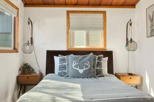 a bedroom with a large bed with two night stands at The Love Shack Big Bear in Sugarloaf