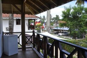 a balcony of a house with a view of a street at Hotel Piedra Marron in Las Terrenas