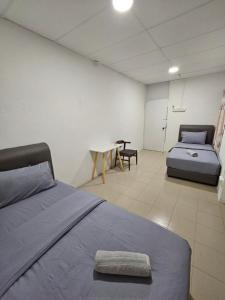 Postel nebo postele na pokoji v ubytování SS HOSTEL PENANG