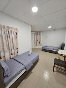 Postel nebo postele na pokoji v ubytování SS HOSTEL PENANG