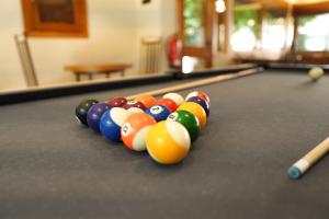 a group of billiard balls on a pool table at Hotel Els Encantats in Espot +51 photos