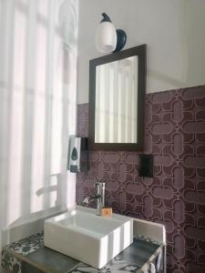 a bathroom with a sink and a mirror at Añoranza Hotel Boutique in Ciudad Hidalgo +95 photos