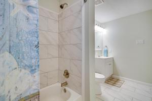 a bathroom with a shower and a toilet at Gulfport Home with Fire Pit RVandTrailer Parking in Gulfport +22 photos