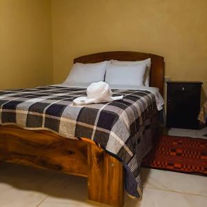 Postel nebo postele na pokoji v ubytování Hostal Kollarón