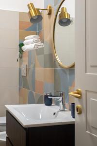 a bathroom with a sink and a mirror at Casa Matta in Castel Gandolfo