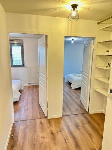 a room with two beds and a closet at Magnificent apart Paris Bagnolet 402 with view in Bagnolet