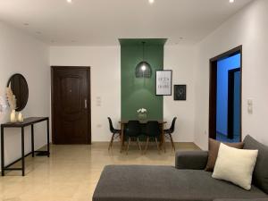 a living room with a couch and a table at A Cozy Apt in Obour City in ‘Ezbet el-Insha