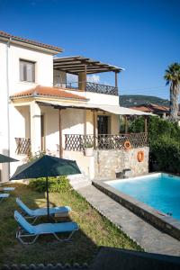 a villa with a swimming pool and a house at Villa Eridos in Káto Lekhónia