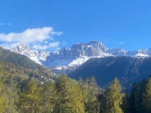 a view of a mountain range with snow at Zimmer 3 am Manötscherhof in Tires