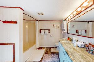 a bathroom with a sink and a toilet at The Lobster Claw in Wells +30 photos