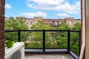 a balcony with a view of a building at Near YYZ and Yorkdale Mall w 2 Free Parking Spots in Toronto