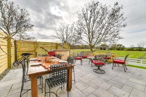 a patio with a table and chairs on a patio at Unique Stay Finger Lakes Converted Horse Barn in Rushville