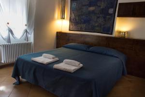 Giường trong phòng chung tại Dimora Dei Giganti