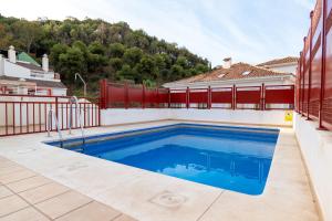 a swimming pool in the backyard of a house at Estudio Céntrico Agua Gibralfaro con Piscina in Málaga