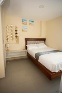 A bed or beds in a room at COMODO DEPARTAMENTO CERCA DE LA PLAYA WIFFI