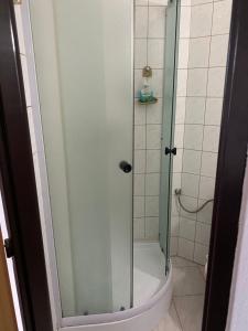 a shower with a glass door in a bathroom at Penzion na Bystřici in Miletín