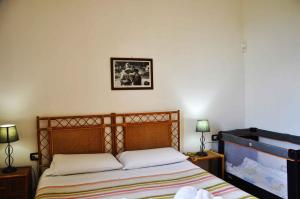 سرير أو أسرّة في غرفة في Holiday home in Lido di Noto 23363