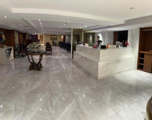 a lobby of a hotel with a reception counter at Taxim Express Bosphorus Hotel in Istanbul