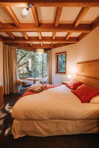 Postel nebo postele na pokoji v ubytování Hotel y Termas Huife