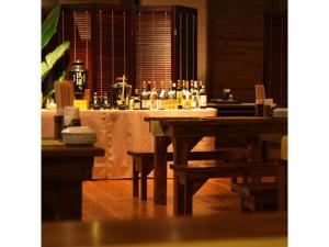 a table in a restaurant with a table with drinks at Hotel Hamahigashima Resort - Vacation STAY 10606v in Uruma +45 photos