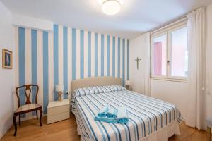 Postel nebo postele na pokoji v ubytování SeaView Cavi B. [100mt dal Mare]
