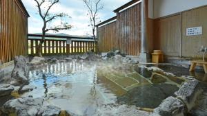 a water fountain in the middle of a building at Chikugogawa Onsen Kuwanoya - Vacation STAY 44682v in Ukiha