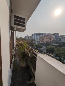 a balcony with a view of a city at Hotel Aron By The Premium Villa in New Delhi