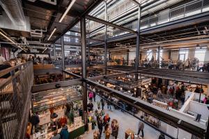 an overhead view of a crowd of people in a shopping mall at Brewhalla Hotel in Fargo